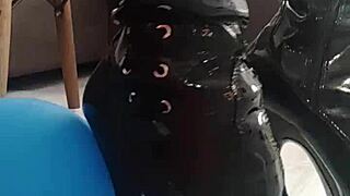 veve pops balloons in latex stockings