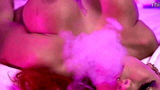 Curvy redhead smokes into busty seduction tease