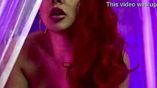 Curvy redhead smokes into busty seduction tease