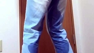 A desperate girl wets her jeans waiting for bathroom.
