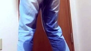 A desperate girl wets her jeans waiting for bathroom.