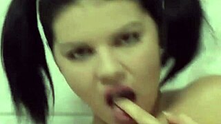 Naughty brunette Daisy fingers pussy with dildo in steamy bathtub