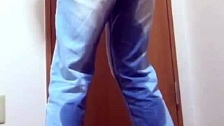 A desperate girl wets her jeans waiting for bathroom.