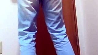 A desperate girl wets her jeans waiting for bathroom.