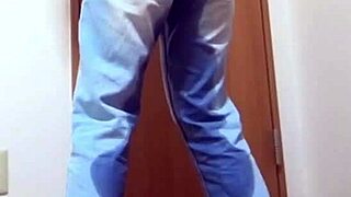 A desperate girl wets her jeans waiting for bathroom.