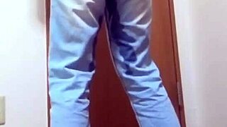 A desperate girl wets her jeans waiting for bathroom.