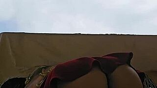 naughty maid flashes big ass under skirt on the balcony
