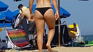 hidden cam catches bikini slut's ass at beach