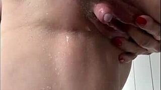 milf SPRAYS CLIT JUICE in SHOWER while FINGERING wet TITS and PUSSY