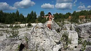 She Dances Topless in Sunlit Stone Quarry