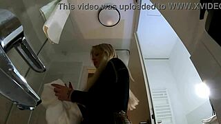 big tits big ass hot blonde babe in pantyhose and high heels with a miniskirt does a striptease in the bathroom