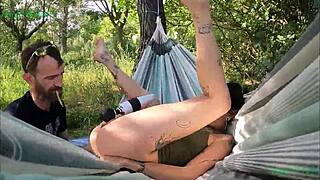 Emo teen satisfies pierced nipples with toys on outdoor hammock swing