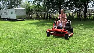 Neighbor riding lawnmower naked outdoors