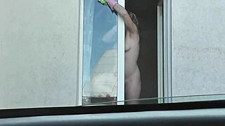 Nude woman neighbor sexy mature milf without panties and bra washes windows her apartment a taxi driver watches from car solo naked in public peeping outdoor outside publicly big natural tits pussy
