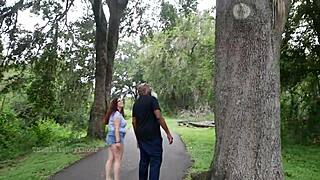 Nerdy milf strokes and sucks big black cock in the park