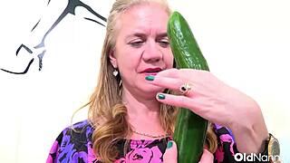 oldnanny horny mature blonde fucks her pussy with big cucumber and vibrator