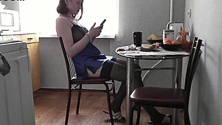 Typical morning of cute girl with beautiful legs in kitchen preparing coffee and breakfast