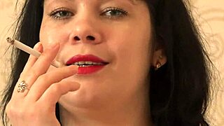 Brightly red lips smoke and suck rubber toy