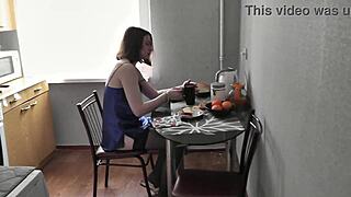 Typical morning of cute girl with beautiful legs in kitchen preparing coffee and breakfast