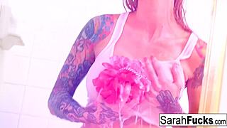 Sexy tattooed beauty sarah fucks herself in the shower