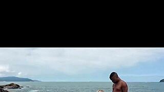 Married redhead with blonde friend at deserted beach rocks